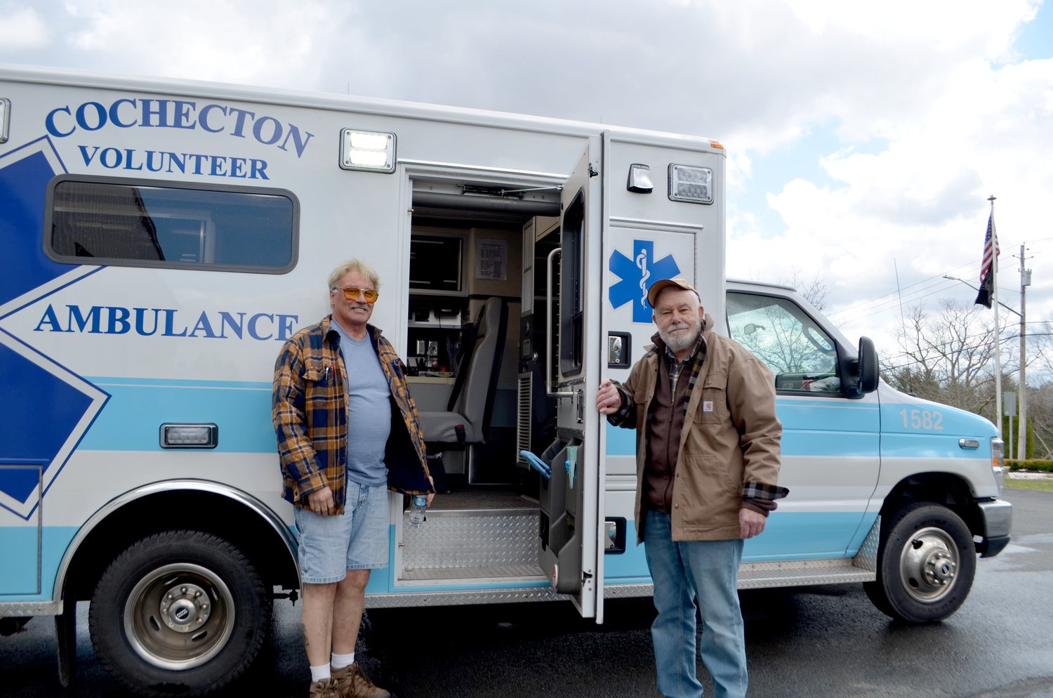 Cochecton Volunteer Ambulance Corps president Mike Attianese and vice-president Peter Grosser, caretaking the newer of the corps' two ambulances.